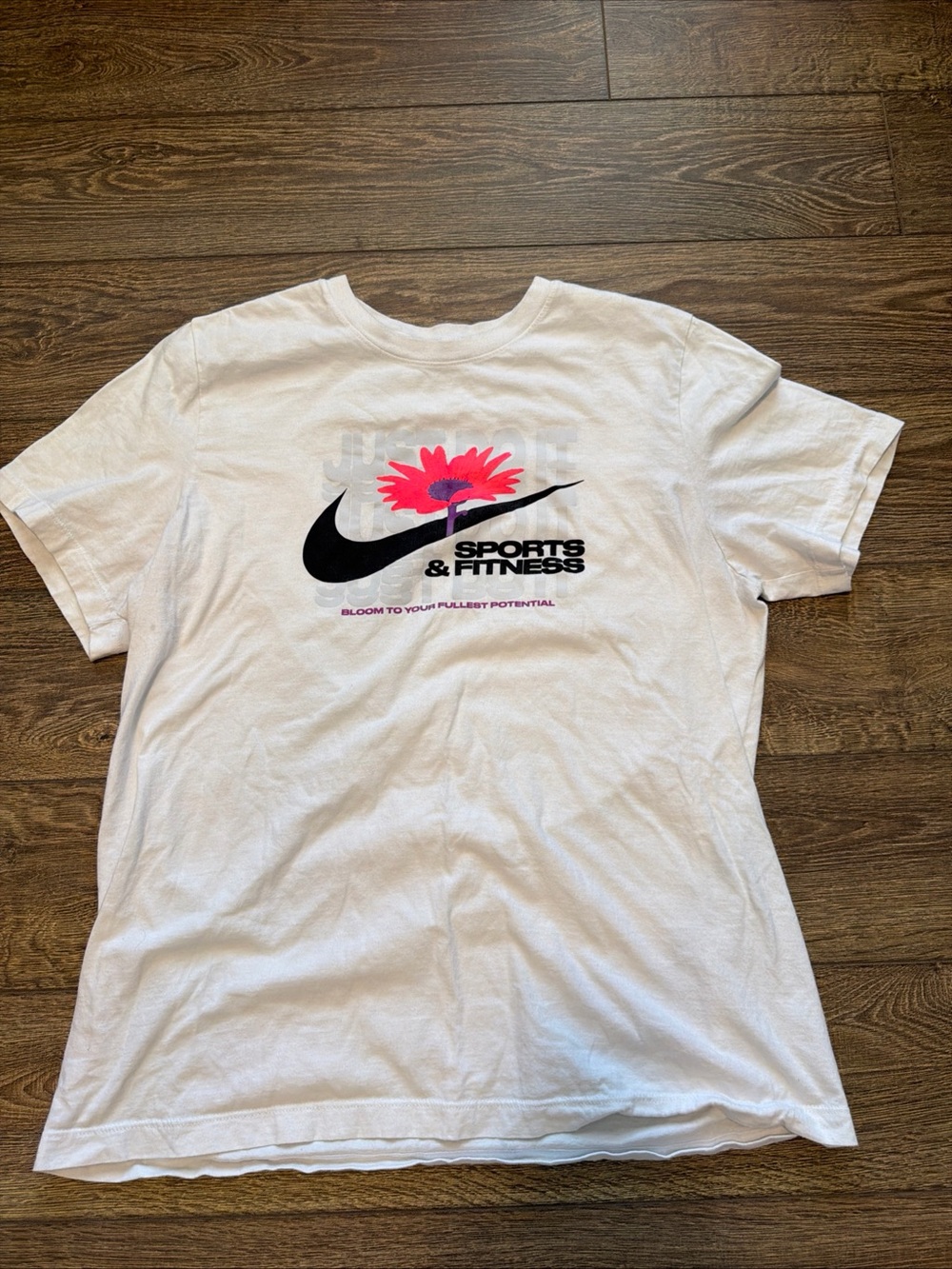 Nike White Short Sleeve T-Shirt with Black Swoosh and Pink Flower Graphic